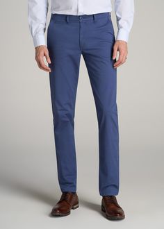 About Our Long Inseam Pants Our tall men's Carman Chinos can be worn with anything, from a fitted tee to a smart blazer. The Carman Chinos are comfortable around the hips and thighs and come in extra-long sizes, crafted specifically for tall men between 6'3” and 7'1”. We always make sure that our pants for tall men not just style well but can be worn no matter the activity. Pants for taller guys are a critical part of any tall man's wardrobe and the Carman Chinos won't disappoint. Constructed wi Blue Tapered Leg Business Casual Work Pants, Blue Tapered Leg Work Pants For Business Casual, Business Casual Blue Pants With Welt Pockets, Blue Pants With Welt Pockets For Business Casual, Blue Business Casual Work Trousers, Blue Cotton Dress Pants With Pockets, Fitted Blue Chinos With Straight Leg, Blue Straight Chinos For Business Casual, Fitted Denim Blue Pants With Welt Pockets