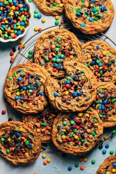 chocolate chip cookies with m & m sprinkles on a cooling rack