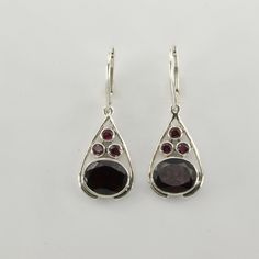 These is a pair of beautiful Garnet Earrings in Sterling Silver. The earrings are made out of solid 925 Silver and there is no nickel or other substances causing most allergies. This makes the earrings hypo allergenic. Size of one Earring 4.0 x 1.5 cm or  1.57 x 0.59 inch You will receive the item in a gift box - perfect to surprise someone or yourself. Usually we ship on the same day we receive the payment for the order. We want you to be happy with your purchase. If you do not like what you bo Formal Sterling Silver Teardrop Earrings With Lever Back, Silver Faceted Oval Earrings, Silver Oval Faceted Earrings, Oval Teardrop Earrings For Anniversary, Faceted Sterling Silver Teardrop Earrings, Faceted Teardrop Sterling Silver Earrings, Oval Sterling Silver Teardrop Earrings, Teardrop Dangle Earrings, Amber Ring