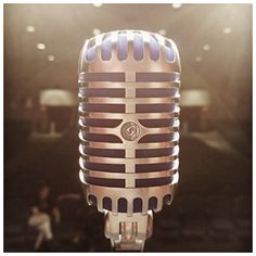 an old fashioned microphone in front of a stage