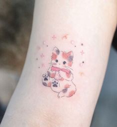 a small cat tattoo on the left ankle and right leg, with stars in the background