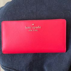 Kate Spade Long Wallet Saffiano Leather Red / Shiny Gold Accents Front Has Pin Mount 3 Line Logo Gold Raised Known Quality Excellent Stitching And Seaming Back Has Zippered Expanding Coin Pocket Gold, Zipper And Pull Designer Name On Pull Tabs With Snap Interior Closure 10 Interior Card Slots 1 Id Holder Four Interior Long Pockets Gold Foil Imprint, Three Line Logo Size 7”L X 3.5”H X 5/8”D Thanks For Visiting My Closet. Come Back Soon! I Am Not Offended By Offers! Leave Me A Comment, So I May Be Classic Red Wallets With Removable Pouch, Red Formal Wallet With Zipper Closure, Formal Red Wallet With Zipper Closure, Red Clutch Wallet With Interior Card Slots, Red Wallets With Removable Pouch For Daily Use, Red Bifold Bag With Zipper Closure, Red Clutch Wallet For Travel, Red Kate Spade Wallets For Everyday Use, Denim Wallet