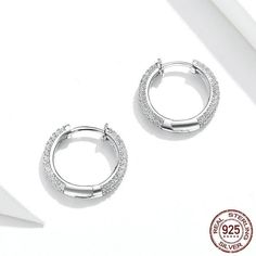 These stunning sterling silver cubic zircon hoop earrings are a beautiful addition to a ladies' outfit. Every piece is beautifully arranged and made with a 925 sterling silver high polished finish covered with zircon stones and comes packed in a Cycolinks gift bag. ✔️ FREE Worldwide shipping, we ship to over 250 Countries! ✔️ 925 sterling silver, platinum-plated, 3 layer electroplating to last! ✔️ Weight - 1.6g pair ✔️ Connection type: Simple ear clip ✔️ The materials are 925 sterling silver env