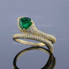 This ring is made with Pear Zambian Emerald Genuine Gemstone Ring/ Real Cluster Diamond Pave Ring/ 18K Solid Gold Snake Ring/ Serpent Ring/ Wrap Around Ring. * SKU: SPBR00600 * Made to Order. * Gold Purity: 18K Solid Yellow Gold (stamped) * Custom Gold Color: Yellow, Rose, White Gold * Custom Gold Purity: 9K/14K/18K (Charges Apply) * Diamond 100% Genuine Diamond * Diamond Weight: 0.67 ct. * Diamond Color: G-H * Diamond Clarity: SI1- SI2 * Diamond Cut: Brilliant Cut (Excellent) * Emerald Weight: Gold Ring With Center Stone For May Birthstone, Yellow Gold Diamond Ring With Stone Setting, Gold Diamond Ring With May Birthstone Accent Stones, Gold Diamond Ring With Accent Stones For May Birthstone, Gold Emerald Ring Promise Fine Jewelry, Gold Ring With May Birthstone In Fine Jewelry Style, Gold Emerald Ring With Prong Setting, Gold Emerald Diamond Ring With Prong Setting, Gold Emerald Ring With Diamonds