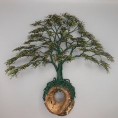 a decorative tree is hanging on the wall