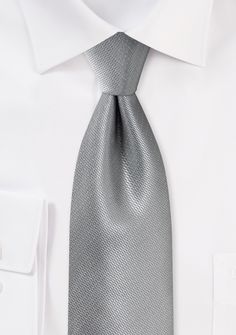 A Formal Silver Small Texture Necktie can be a great accessory to add a touch of elegance and sophistication to a variety of formal occasions, including shopping for suits, tuxedos, and men's suits for weddings. When shopping for suits, a silver small texture necktie can be paired with a variety of suit colors, such as black, navy blue, charcoal gray, or even light gray. It's a classic and timeless choice that can complement any outfit. When shopping for a tuxedo, a silver small texture necktie Suits For A Wedding, Grey Wedding Theme, Suit Colors, Black Suit Dress, Silver Tie, White Tuxedo, Grey Wedding, Grey Tie, Black Tuxedo