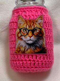 Hot Pink candle cozy for a 22oz Yankee Candle jar. I have crocheted the cozy using 100% Hot Pink Acrylic yarn. On the front I have added a heat transfer of a Kitten in glasses. There is a thin cord running along the top edge to tie up the cozy tighter. These can be used as a mason jar cover, candle cozy, or candy jar cover. Put a battery tea light inside for a soft glow. Mason jars make great gift ideas for birthdays and parties. Great idea when the candle begins leaving black marks inside the jar, just cover with one of these cozies and you no longer see the black marks. The top is open and safe for burning the candle. The item includes only the crocheted cozy, not the Candle. Glow Mason Jars, Hot Pink Candles, Candle Cozy, Crochet Candle, Yankee Candle Jars, Battery Tea Lights, Pink Candle, Cozy Cover, Candle Sleeves