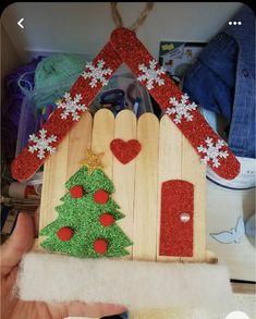 a wooden house with a christmas tree on it