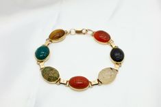 Free eBay listing template designed by dewiso.com 14k Vintage Yellow Gold Hardstone Multicolor Seven Scarab Ladies Bracelet 7.0" Details This beautiful multi stone scarab bracelet features 7 gemstone such as Carnelian ,Tigers Eye, Agate, Chalcedony, Quartz,  Pink opal  Specifics Total length 7.0"  Total weight 17.7 Grams (hallmarked 585) Gemstone size approximate  12mm x 10mm  Contact us We can be contacted at any time through eBay messages if you have any questions, comments or product requests. We do our best to respond within 24-48 hours! We encourage our customers to contact us with any questions or concerns! We'd like to be sure you are completely satisfied with your purchase. Payment Credit, debit, gift cards, Apple Pay, Google Pay, PayPal and PayPal Credit through eBay managed payme Eye Agate, Scarab Bracelet, Ladies Bracelet, Quartz Pink, Google Pay, Fine Jewelry Bracelets, Tigers Eye, Pink Opal, Apple Pay