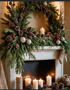 a fireplace decorated for christmas with pine cones and candles