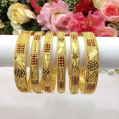 Handmade Indian Bridal Jewellery 22ct Micro Gold & Rhodium Plated 6 Bangles  Pakistani Indian Gold Plated Jewelry Set Of 6 PLEASE NOTE, This Item Is Not Real Gold .Only Good Quality Gold Plated Jewellery .This is Artificial Jewellery.  Traditional Indian Wedding Jewellery Slight Colour variations possible due to difference in screen and photograph  It is a perfect match with formal attire on special occasions or with casual wearing Care instructions Keep Jewellery away from direct heat, water, perfumes, deodorants and other strong chemicals as they may react with the metal or plating. The plating composition of Jewellery is as such that  perspiration (sweat) will not damage it. Wipe Jewellery gently with chamois cloth or leather swatch after every use. Wiping the jewellery with a soft clot Gold Dual-tone Jewelry For Puja, Traditional Yellow Gold Bracelet For Wedding, Gold Dual-tone Bangle Jewelry, Gold Dual-tone Bangle For Gift, Gold Meenakari Bracelets For Puja, Gold Dual-tone Bangle As A Gift, Gold Dual-tone Bracelet For Gift, Dual-tone Gold Bracelet As Gift, Dual-tone Gold Bracelet For Gift