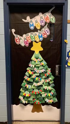 a christmas tree made out of toilet paper is on display in front of a door