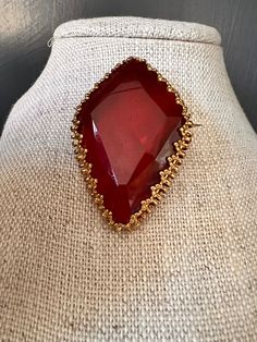 "This stunning unique red stone is  a diamond shape lozenge shape ruby red glass stone. The stone is set in a beautiful ornate gold tone filigree bezel.  The brooch is marked made in West Germany.  This helps date the brooch between the years of 1949- 1980.  Measurement: 2\" x 1.25\" Item will be gift wrapped and shipped free of charge to US destinations." Red Cabochon Jewelry For Formal Occasions, Red Brooch Jewelry For Formal Occasions, Unique Red Jeweled Jewelry, Red Marquise Jewelry For Formal Occasions, Antique Jeweled Red Jewelry, Red Formal Costume Jewelry Brooches, Red Victorian Jewelry For Evening, Vintage Ruby Evening Jewelry, Red Brooch For Jewelry Making