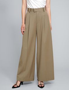 Tan high-waisted pants . Styled with Olympia Tee . 80% polyester, 20% rayonSide pocketsBack faux pocket Size S waist 26.5", hips 37", length 41" Inseam 30" Size M waist 28", hips 39", length 42" Inseam 30.5Size L waist 29.5", hips 40", length 43" inseam 31" Model wears size S and is 5.8"/ 170 cm Imported Chic Wide-leg Work Pants With Pockets, Beige Wide Leg Bottoms With Belt Loops, Fall Wide Leg Work Pants With Welt Pockets, Beige Wide Leg Pants With Belt Loops, Spring Full-length Wide Leg Pants With Hip Pockets, Full Length Pants For Business Casual In Summer, Summer Business Casual Full Length Pants, Full Length Smart Casual Summer Pants, Full Length Business Casual Summer Pants