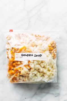 a bag of popcorn sitting on top of a marble counter