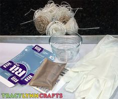 the supplies needed to make this craft include yarn, gloves, and paper napkins