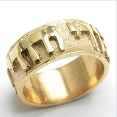 This stunning ring is made of 14k Yellow Gold. Its our widest and most substantial Jewish Wedding band. It has the quote "Ani Le Dodi V' dodi Li" written in raised letters around the band. The ring is completely solid throughout and the letters are solid as well. The ring measures 8mm wide and is beautifully made. Ring is available in sizes 5 - 10 Please contact us for availability of additional sizes Allow 3 week delivery time for all wedding bands Also available in white gold Jewish Wedding Rings, Mens Sterling Silver Jewelry, Open Wedding Band, Jewish Marriage, Gorgeous Rings, Raised Letters, Star Of David Pendant, Man Stuff, Wide Ring