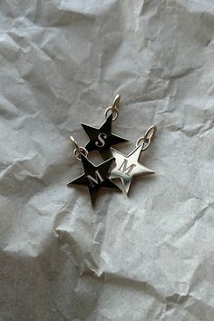 These are our Classic Star Charms with laser engravings on initials. Star Charms, Initials