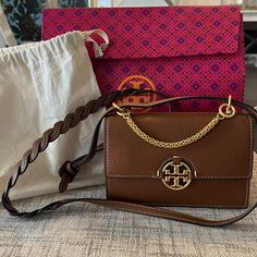 Brand New Never Used Miller Mini Tory Burch Crossbody Product Measurements Depth 2.4 In Height 4.7 In Strap 20.9 In Width 7.5 In Please See Separate Listing With Matching Wallet Includes Bag And Dust Bag Tory Burch Crossbody, Tory Burch Bags, Mini Crossbody, Tan Brown, Crossbody Bags, Tory Burch, Dust Bag, Wallet