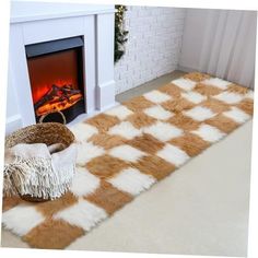 a living room with a fireplace and rugs on the floor