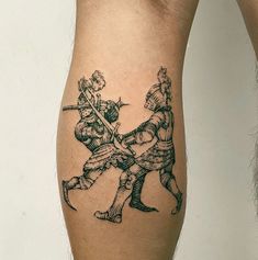 a man with a tattoo on his leg holding onto another person's arm while they both hold swords