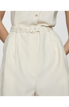 A tonal belt hugs the waist of this sleeveless romper topped by a cute spread collar. Front button closure Spread collar Sleeveless Removable belt 93% viscose, 7% polyester Machine wash, line dry Imported Chic Belted Jumpsuits And Rompers For Spring, Spring Workwear Jumpsuits And Rompers, Short Length, Chic Jumpsuits And Rompers With Belt For Workwear, High Waist Jumpsuits And Rompers For Summer Workwear, Elegant Belted Bottoms For Summer, Elegant Belted Jumpsuits And Rompers For Summer, Fitted Jumpsuits And Rompers With Belt For Spring, Elegant Spring Jumpsuits And Rompers With Belt Loops, Elegant Bottoms With Belt For Summer