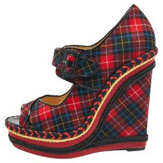 These pumps from Christian Louboutin are designed to bring comfort and style at the same time. They are made from tartan-print fabric and added with peep toes, buckled straps, leather lining, and wedge heels. Louboutin Shoes Women, Lady Peep Louboutin, Louboutin Wedges, Wedges Outfit, Red Sole Heels Christian Louboutin Shoes, Christian Louboutin Shoes Heels & Wedges, Christian Louboutin Pigalle, Womens Sandals Wedges, Wedge Pumps