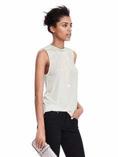 Everyday Stretch Sleeveless Knit Top, Sleeveless Stretch Knit Top For Everyday, Sleeveless Knit Top For Workwear, Chic Layering Tank Knit Top, Chic Layering Knit Tank Top, Chic Tank Knit Top For Layering, Sleeveless Knit Top For Summer Workwear, Chic Sleeveless Knit Top For Work, Sleeveless Stretch Knit Top For Work