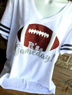 a t - shirt that says it's gameday with a football on it