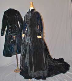 "Antique Bustle Dress 1870s Walking Suit Outfit - 3-Piece Trained - Museum Deaccession This is an attractive reception outfit of the 1870's period, that a mid to upper class woman would wear. A regal 1870's - 1875 deep navy blue and black velvet 3 piece in construction bustled reception outfit recently de-accessioned from the Rochester historical society museum in New York state. The outfit still retains it's original Museum ID catalog identification tag, inside each jacket with donor's name on Victorian Costume Dress With Buttons, Victorian Style Costume Dress With Buttons, Antique Fitted Victorian Dress With Historical Design, Green Velvet Gown, 1870s Dress, Train Museum, Reception Outfit, Suit Outfit, Bustle Dress