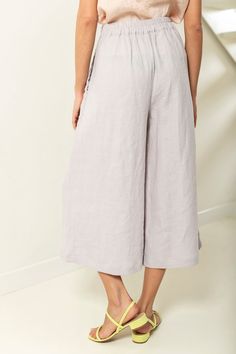 "Linen culotte pants with pockets. These drapey cullotes have flared cut, elastic back waist and pockets in side seams. Their legs are wide but not too wide to look like a skirt. You would love these flowy culottes, if you like unrestricted movement. Mid-calf length and relaxed silhouette make them a perfect pick for various casual occasions. ABOUT US LINEN ID was born from desire to embrace things that actually matter. We aim to create sustainable garments that offer uncompromised design, are v Spring Linen Culottes With Pockets, Chic Linen Culottes For Spring, Summer Relaxed Fit Culottes With Pockets, Summer Culottes With Relaxed Fit, Summer Relaxed Fit Ankle-length Culottes, Summer Ankle-length Relaxed Fit Culottes, Spring Linen Wide Leg Culottes, Spring Linen Wide Leg Pants With Elastic Waistband, Spring Wide Leg Linen Culottes