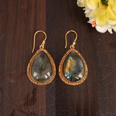 Labradorite Dangle Earrings, Teardrop Earrings For Women, Flashy Labradorite, Pear Shape Brass Earrings, Long Handmade Earrings, Bridal Gift Description : Metal : Brass Gemstone :  Labradorite Stone Size  : 25x18 MM Approx Weight : 14.61 Gram Approx Earrings Length :- 40 Millimetres Item Code : EMS- 5246 ❣❣ Handmade Item ❣❣   **Made to Order** » G EM S T O N E D E T A I L « **Gemstone structure may vary from the image as two gemstones do not have the same structure** If you want to see the picture of gemstone, then feel free to contact us. » C U S T O M I Z E O R D E R « All gemstone jewelry is made with silver and brass. If you want to make any changes with this jewelry, then please send us a message. We will make as per your requirements. For more beautiful designs please visit our Etsy Teardrop Labradorite Earrings, Handmade Long Drop Labradorite Earrings, Teardrop Danglers For Gift, Handmade Labradorite Teardrop Earrings, Bohemian Gemstone Teardrop Earrings For Gift, Gift Labradorite Earrings, Labradorite Teardrop Earrings As Gift, Labradorite Teardrop Earrings For Gift, Earrings Teardrop