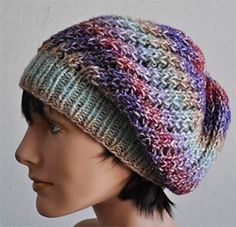 a mannequin head wearing a multicolored hat