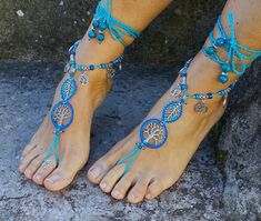 This listing is for a PAIR of barefoot sandals. Beautiful and unique barefoot sandals with a spring vibration. They look great as necklace or on the hands too :) Handmade crocheted with love and care using waxed polyester cord, tree of life tibetan silver links and charms, tibetan silver beads, greek ceramic beads and czech seed beads. The lace is long enough to wrap it 2 times around the leg. These sandals are very resistant and suitable for many environments. They will embellish your feet and Bohemian Turquoise Anklets For Festivals, Bohemian Beaded Barefoot Sandals For Wedding, Blue Bohemian Ankle Wrap Anklet, Handmade Blue Barefoot Sandals For Beach, Blue Beaded Barefoot Sandals For Festival, Handmade Bohemian Blue Barefoot Sandals, Handmade Blue Barefoot Sandals For Vacation, Blue Handmade Bohemian Barefoot Sandals, Bohemian Blue Barefoot Sandals For Festival