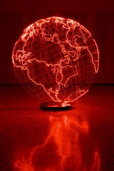 a red light shows the shape of a globe