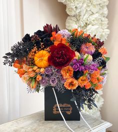 a bouquet of flowers sitting on top of a table