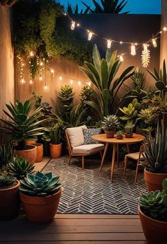 an outdoor patio with potted plants and string lights