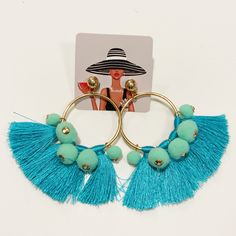 Gold Hoop Tassel/Pom Poms Earrings Hoop Tassel Earrings Featuring Small Pom Poms. Measurements: 1.5 X 3.0" Approx. Blue Bohemian Hoop Earrings For Party, Bohemian Blue Hoop Earrings For Party, Trendy Summer Jewelry With Tassels, Summer Beach Turquoise Tassel Earrings, Trendy Summer Festival Tassel Earrings, Summer Festival Trendy Tassel Earrings, Turquoise Tassel Drop Earrings For Summer, Turquoise Tassel Earrings For Summer, Turquoise Fringe Earrings For Summer