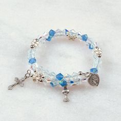 Full of Grace First Communion   Hand-crafted rosary bracelets   https://ourladysrosegarden.com/product/full-of-grace-first-communion-rosary-bracelet #RosaryBracelets Blue Spiritual Bracelets With Birthstone, Spiritual Blue Birthstone Bracelets, Spiritual Silver Beaded Bracelets For First Communion, Blue Spiritual Jewelry For First Communion, Blue And White Crystal, Pray The Rosary, Rosary Jewelry, The Eucharist, How To Pray