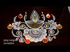 an image of a decorated diya with candles