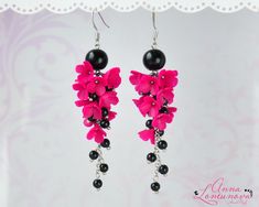 "Black pink earrings Hot pink statement earrings Hot pink bridesmaid earrings Flowers long earrings Blooming earring gift Floral pink jewelry Flowers Long earrings with Fuchsia pink flowers, and supplemented with Black glass beads. Hot Pink Flowers Lilacs, made of polymer clay. For these flowers I used high quality polymer clay. Each flower is made by hand in a special technique. Fuchsia Black earrings can be a perfect complement to your dress. Bright floral earrings will be a perfect gift for her Accentuate your individuality with the help of these floral earrings! Length with hooks is about 8.4cm/3.30\" ✿These earrings can be made to order. Please allow 3-7 days for production time. ✿ Real colors may slightly differ from one monitor to another, as it depends on specific monitor settings. Hot Pink Bridesmaids, Pink Statement Earrings, Jewelry Flowers, Hot Pink Flowers, Floral Rosa, Packing Jewelry, Senior Prom, Earring Gift, Pink Jewelry