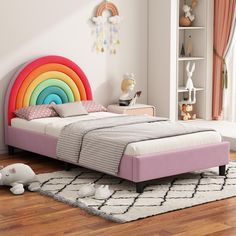 a child's bedroom with a rainbow colored headboard and rugs on the floor