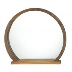 a wooden shelf with a round mirror on it's side and a clock next to it