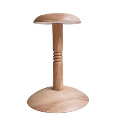 a wooden table with a mushroom shaped top