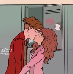 a man kissing a woman in front of a locker with hearts on it's door