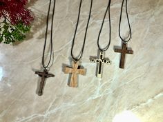 The wood cross pendant measures approximately 3x4cm, making it a small and subtle accessory that can be worn daily. The cord included with the necklace ensures that it's easy to wear and comfortable on your skin. Whether you're expressing your faith or simply looking for a stylish accessory to add to your collection, this wooden cross necklace is the perfect choice. The rustic charm of this necklace is sure to turn heads and spark conversations, and the unique design sets you apart from the crow Wooden Cross Necklace, Memorial Lanterns, Faith Necklace, Resin Pendant Necklace, Necklace Wood, Christian Necklace, Wood Cross, Custom Wedding Signs, Sterling Silver Cross Pendant