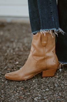 The prettiest pair of boots you'll ever own! And there's no zipper to worry about, because this boot works for everyone! Updated pull-on Western bootie with subtle stitch detailing. Please note that the leather used on this boot will age and distress with wear. Details: Leather upper. Manmade outsole. 7 in / 17.78 cm shaft height. 10 in / 25.4 cm boot opening. 2 in / 5.1 cm heel. Textile lining. Padded insole. Pull-on style. Imported. Fits true to size. Please note: due to the nature of the leat Stacked Heel Ankle Boots For Ranch, Rugged Ankle-high Boots For Fall, Rugged Ankle Boots For Fall, Rugged Snip Toe Heeled Boots For Fall, Rugged Snip Toe Mid-calf Boots For Fall, Rugged Mid-calf Snip Toe Boots For Fall, Chic Leather Boots For Ranch, Chic Leather Ranch Boots, Rugged Almond Toe Boots For Fall