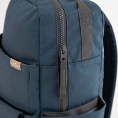 a blue backpack with two zippers on it