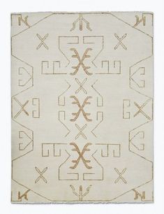 a beige rug with an intricate design on it