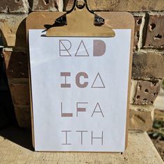 a sign that says rad ica lfa ath on the side of a brick wall